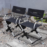 Two PiXAPRO black foldable director’s chair with armrests and silver-coloured frame in a garden setting
