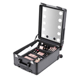 Open PiXAPRO makeup trolley case holding cosmetics and brushes beneath the illuminated mirror