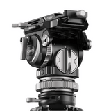 A close-up studio shot of a YC-Onion  CB7 fluid tripod head and top mount, featuring black and silver metal components with visible branding on a clean white background.